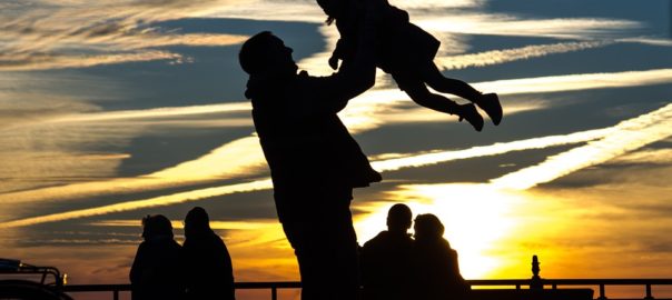 Father carrying child